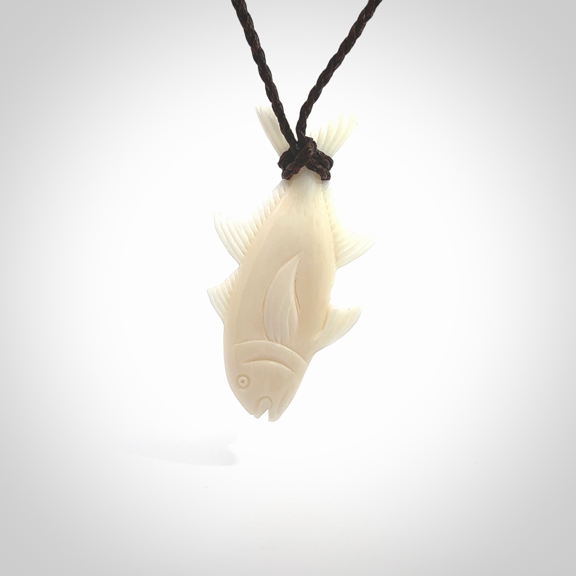 Hand carved bone fish pendant. Hand made bone fish necklace. Fish themed jewellery. Ocean themed pendant. Bone fish necklace provided with adjustable cord and free delivery.