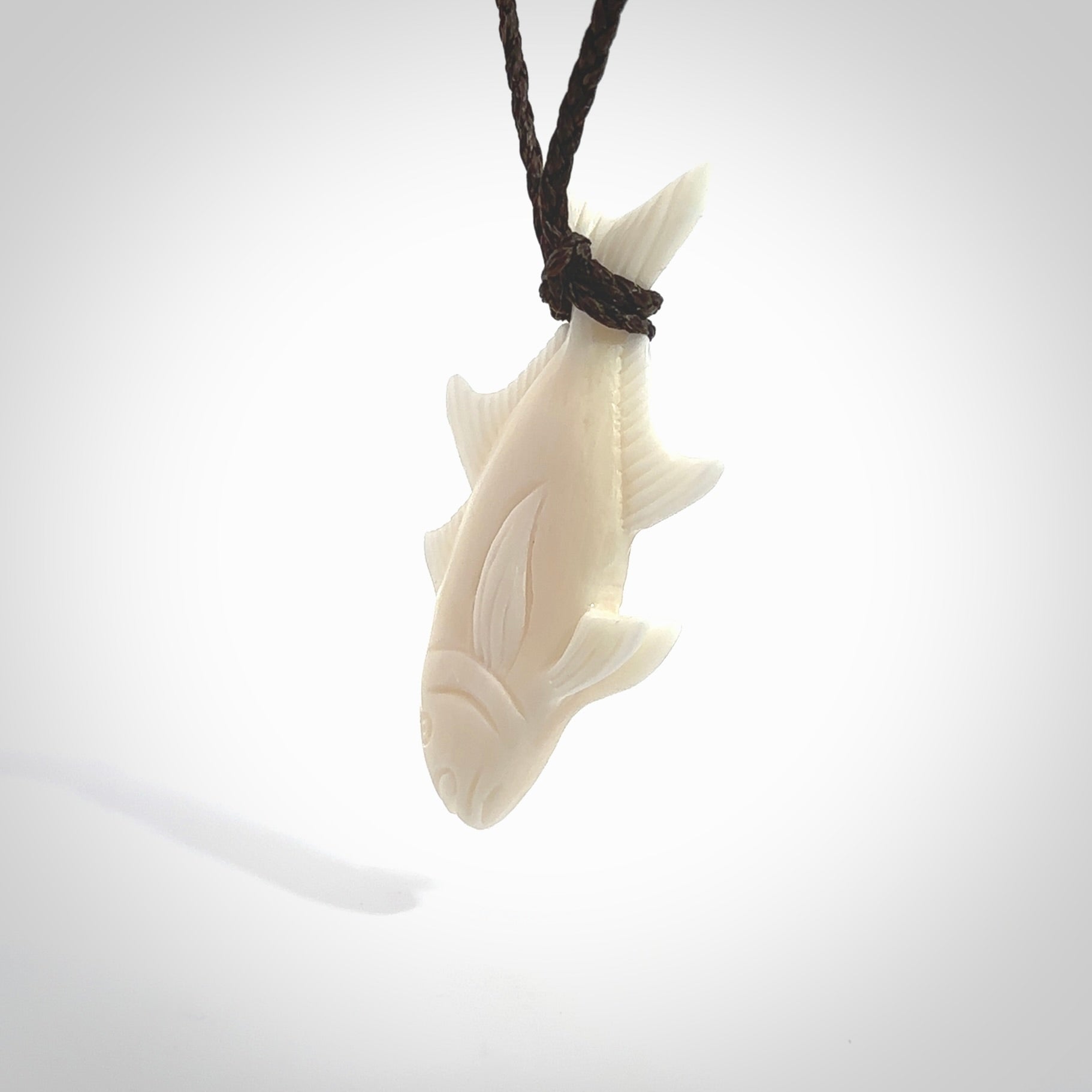 Hand carved bone fish pendant. Hand made bone fish necklace. Fish themed jewellery. Ocean themed pendant. Bone fish necklace provided with adjustable cord and free delivery.