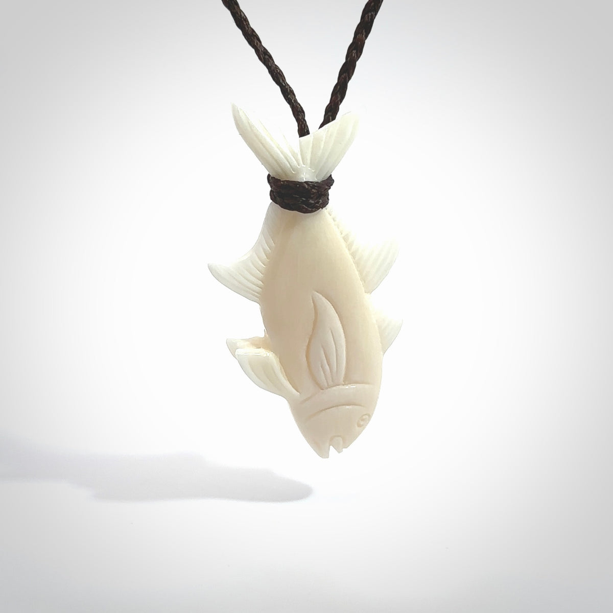 Hand carved bone fish pendant. Hand made bone fish necklace. Fish themed jewellery. Ocean themed pendant. Bone fish necklace provided with adjustable cord and free delivery.