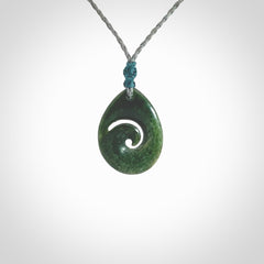 Hand carved New Zealand jade koru drop pendant. Made by NZ Pacific.Hand carved New Zealand jade koru drop pendant. Made by NZ Pacific.