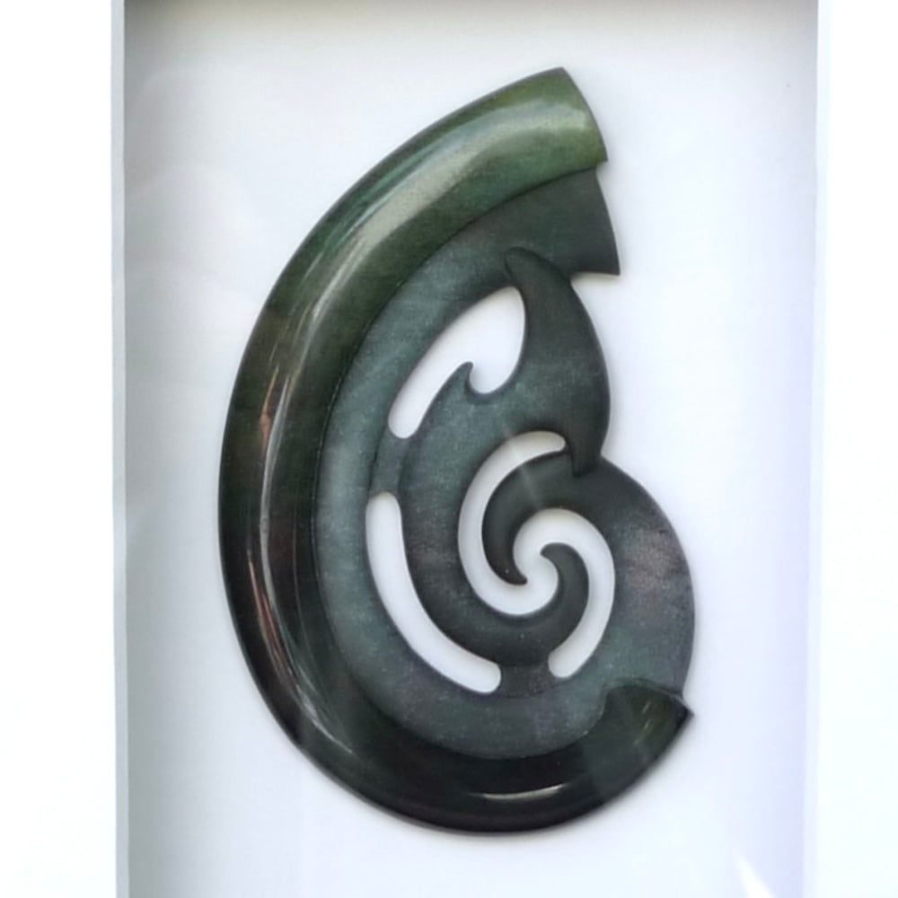 A hand carved large New Zealand Jade Hook, Matau, necklace that has been framed and signed by artist Kerry Thompson. A large sized hand made hook necklace by New Zealand artist Kerry Thompson. One off framed work of art to wear. Delivered with Express Courier.