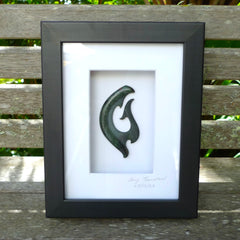 A hand carved large New Zealand Jade Koru necklace that has been framed and signed by artist Kerry Thompson. A large sized hand made koru necklace by New Zealand artist Kerry Thompson. One off framed work of art to wear. Delivered with Express Courier.