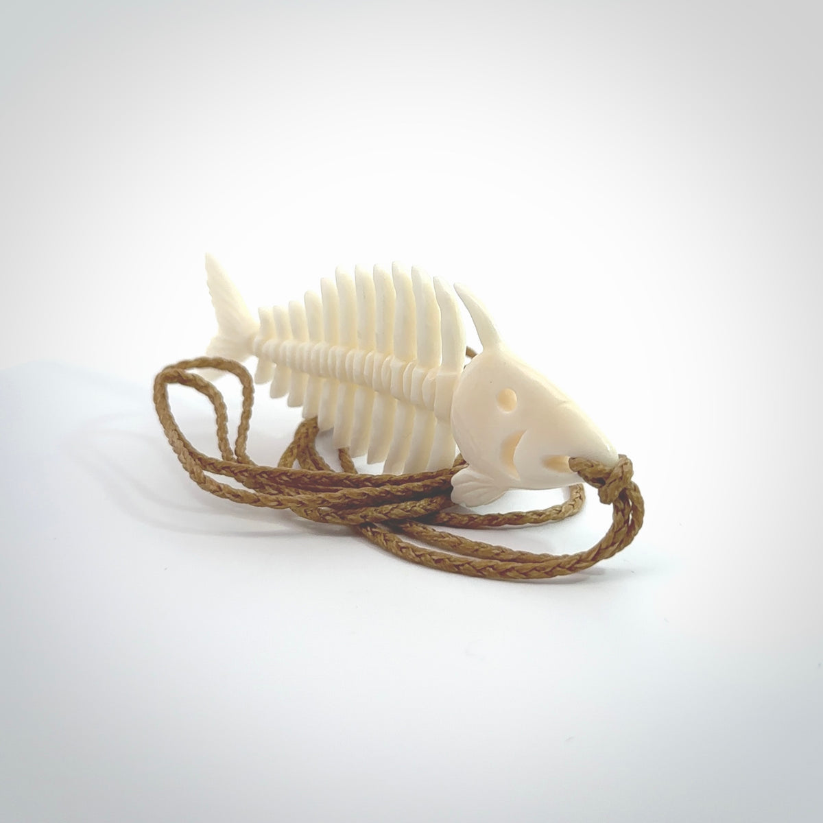 Hand carved bone fish skeleton pendant. Hand made bone fish necklace. Fish themed jewellery. Ocean themed pendant. One only necklace provided with adjustable cord and free delivery.