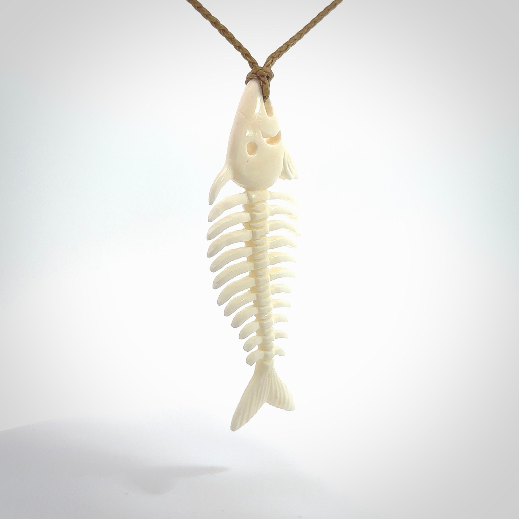 Hand carved bone fish skeleton pendant. Hand made bone fish necklace. Fish themed jewellery. Ocean themed pendant. One only necklace provided with adjustable cord and free delivery.