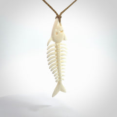 Hand carved bone fish skeleton pendant. Hand made bone fish necklace. Fish themed jewellery. Ocean themed pendant. One only necklace provided with adjustable cord and free delivery.