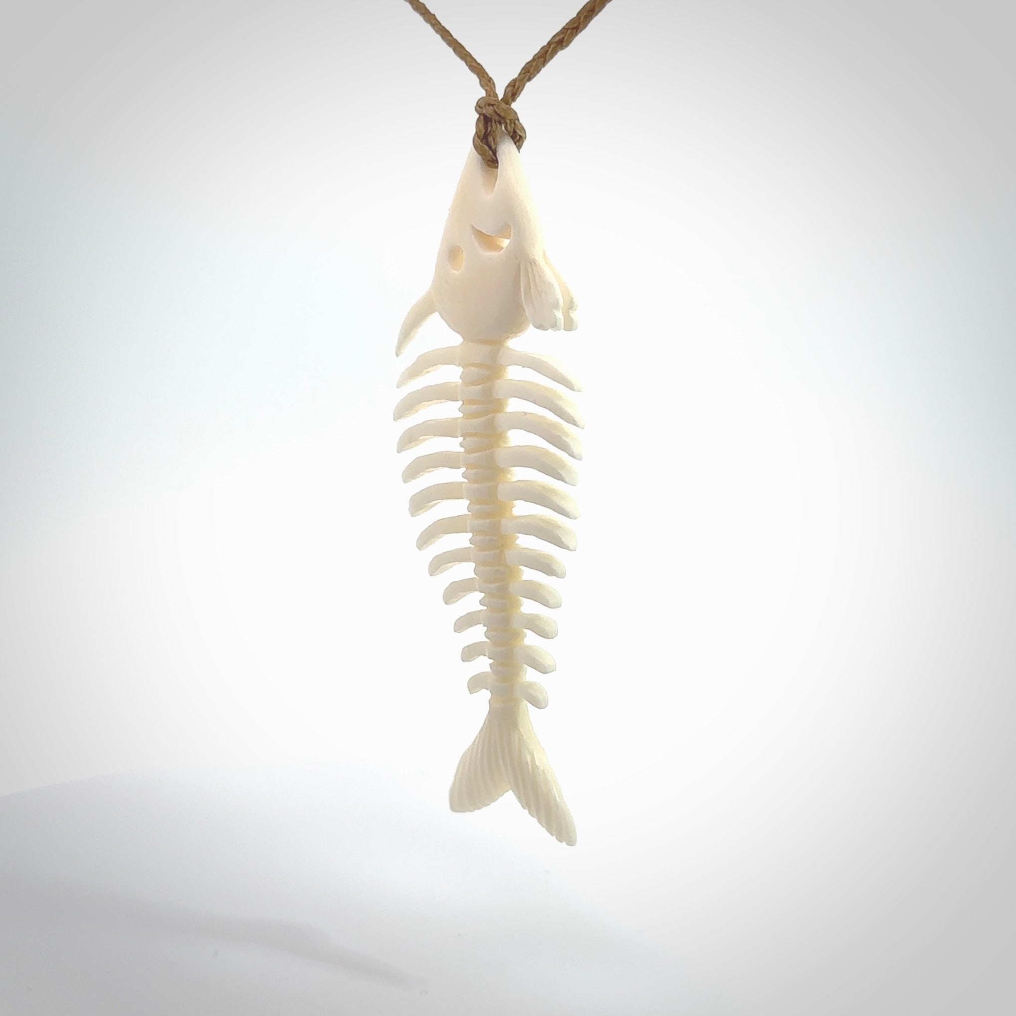 Hand carved bone fish skeleton pendant. Hand made bone fish necklace. Fish themed jewellery. Ocean themed pendant. One only necklace provided with adjustable cord and free delivery.