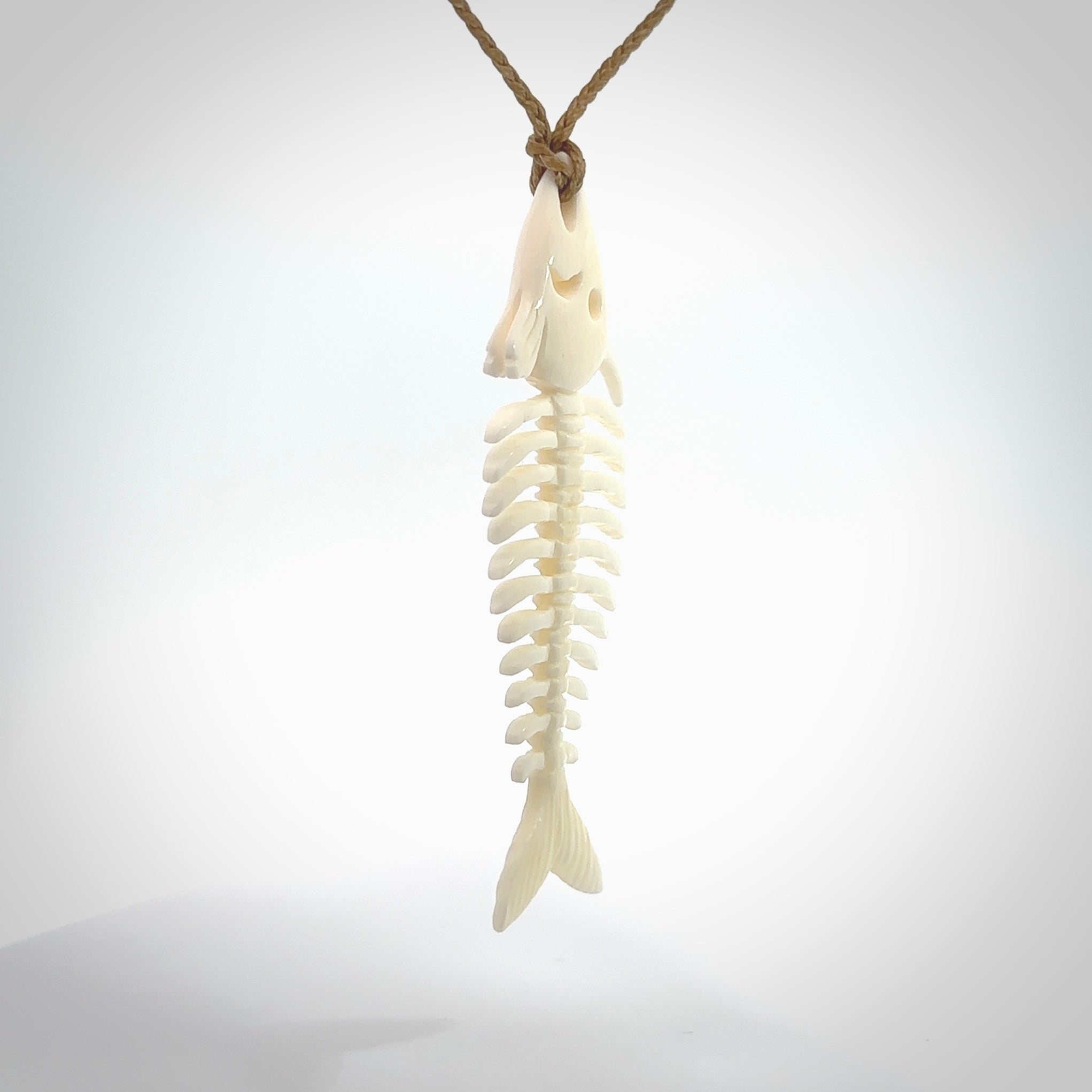 Hand carved bone fish skeleton pendant. Hand made bone fish necklace. Fish themed jewellery. Ocean themed pendant. One only necklace provided with adjustable cord and free delivery.