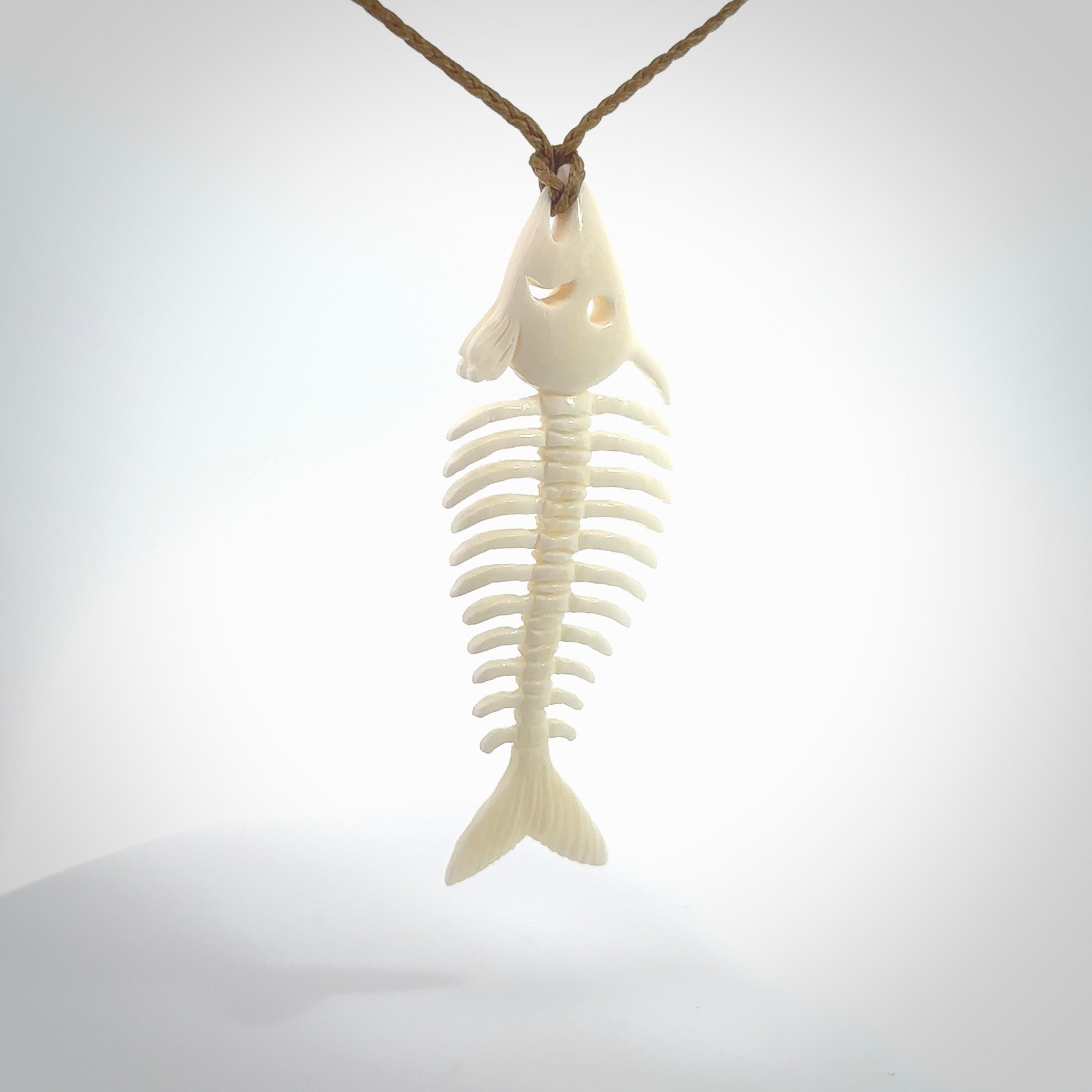 Hand carved bone fish skeleton pendant. Hand made bone fish necklace. Fish themed jewellery. Ocean themed pendant. One only necklace provided with adjustable cord and free delivery.