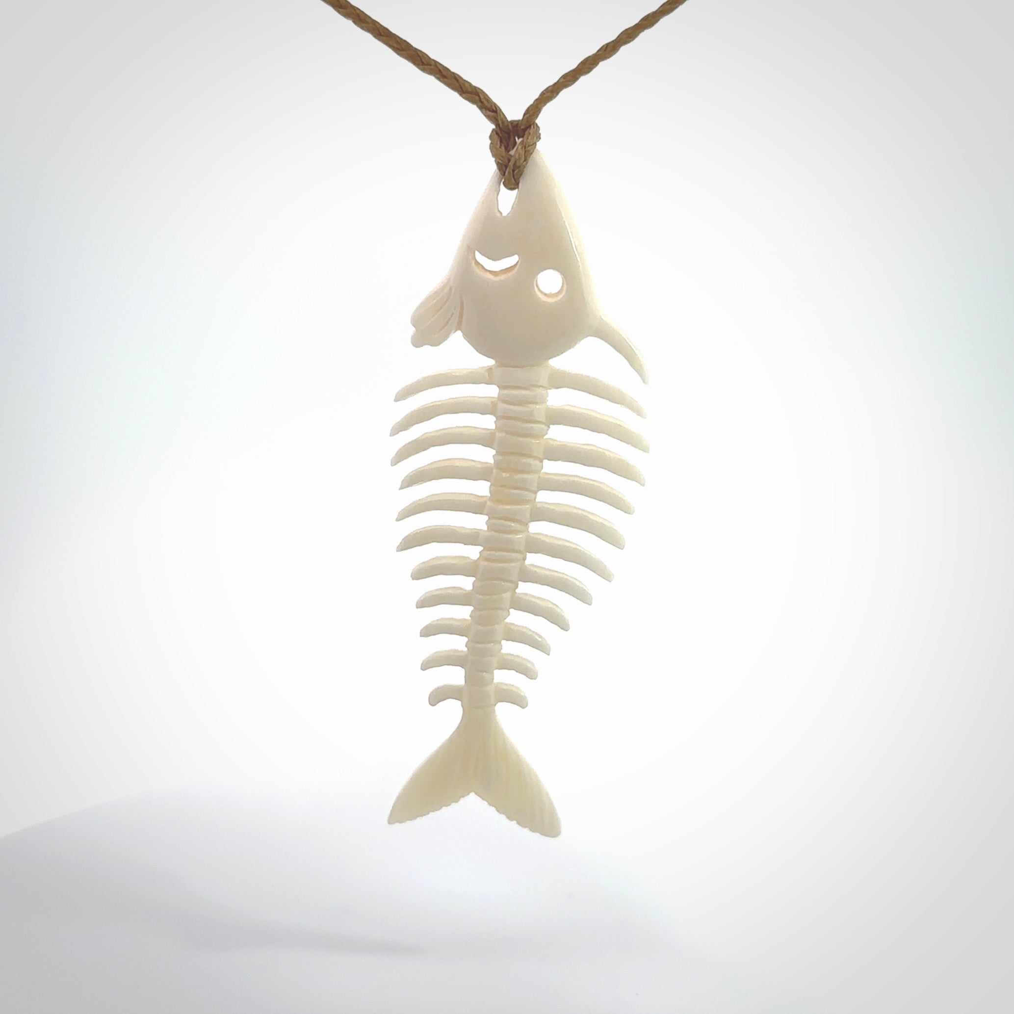 Hand carved bone fish skeleton pendant. Hand made bone fish necklace. Fish themed jewellery. Ocean themed pendant. One only necklace provided with adjustable cord and free delivery.