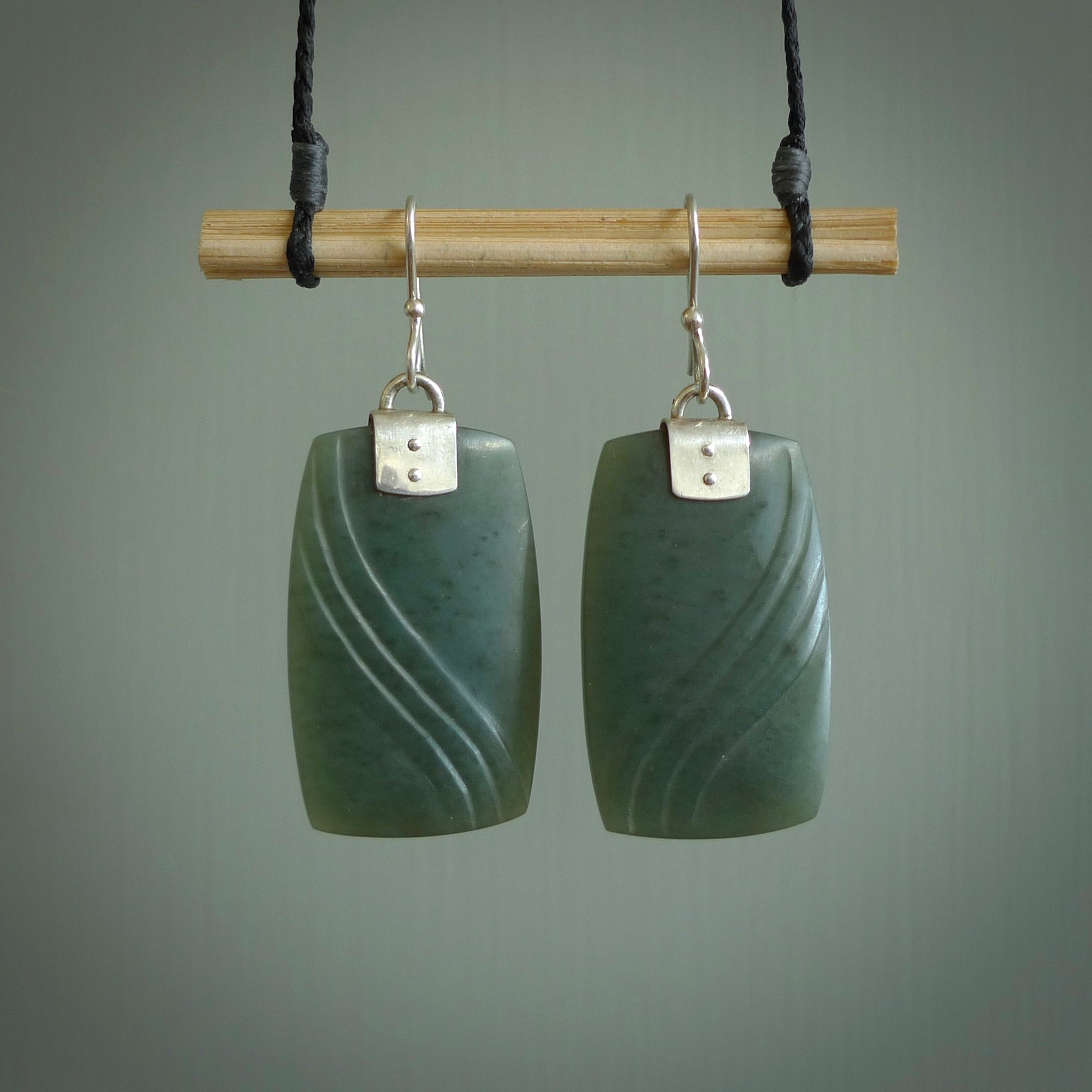 These are stunning large drop jade earrings carved in New Zealand by Josey Coyle. It is carved from a deep green piece of New Zealand Jade and with Sterling Silver hooks and findings.