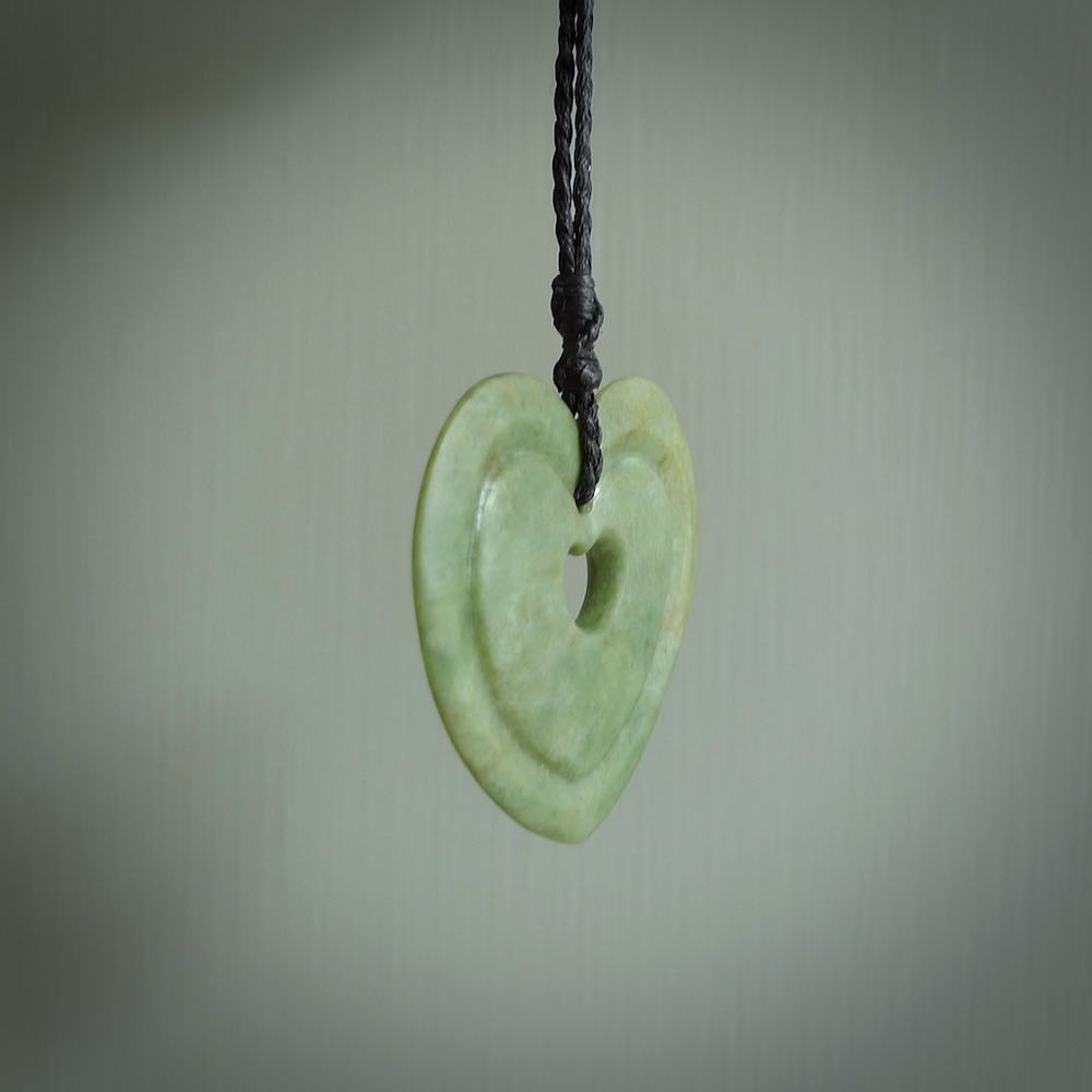 A large hand-carved Jade heart pendant. These are lovely pendants carved from exquisite New Zealand pounamu. Free worldwide delivery. Delivered to you on an adjustable cord.