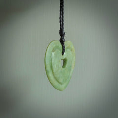 A large hand-carved Jade heart pendant. These are lovely pendants carved from exquisite New Zealand pounamu. Free worldwide delivery. Delivered to you on an adjustable cord.