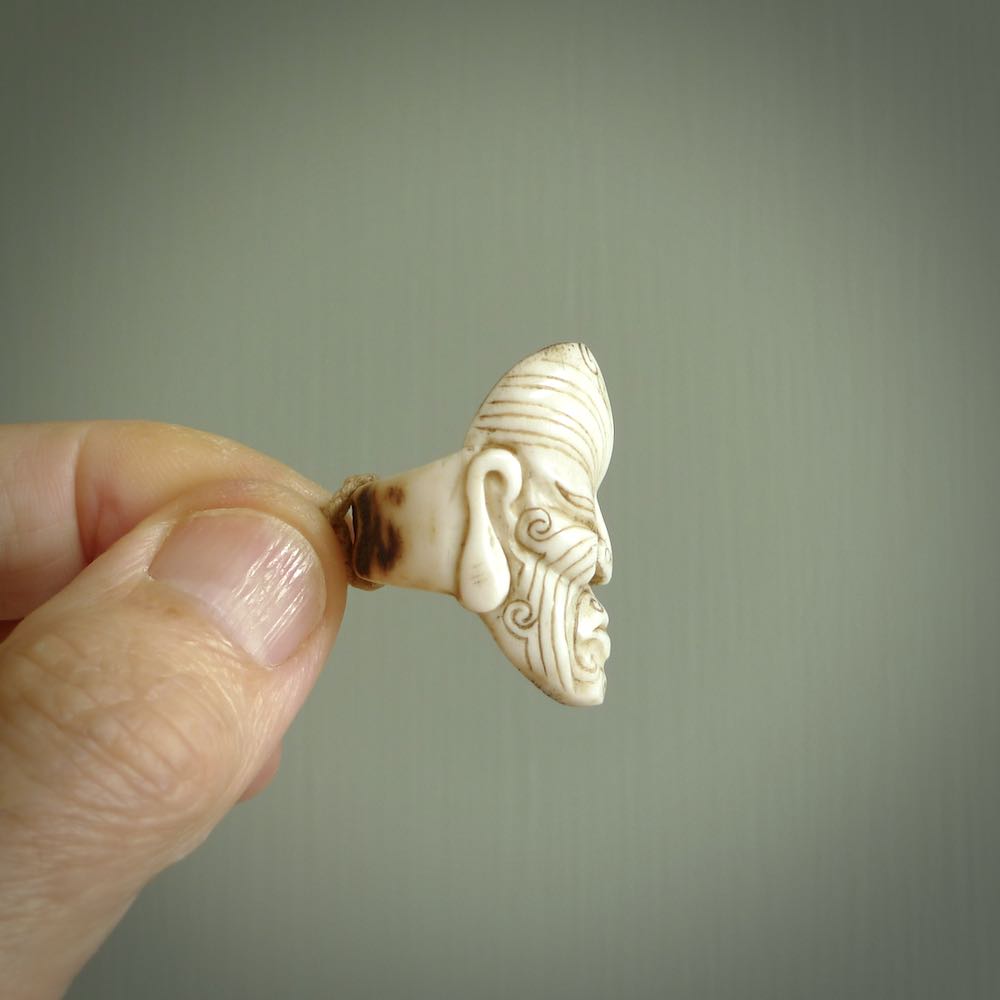 Hand carved Moko man face ring. Made from Red Deer antler in New Zealand. Unique Moko Man ring hand made from deer antler by master bone carver Fumio Noguchi. Spectacular collectable work of art, made to wear. One only ring, delivered to you at no extra cost with express courier.