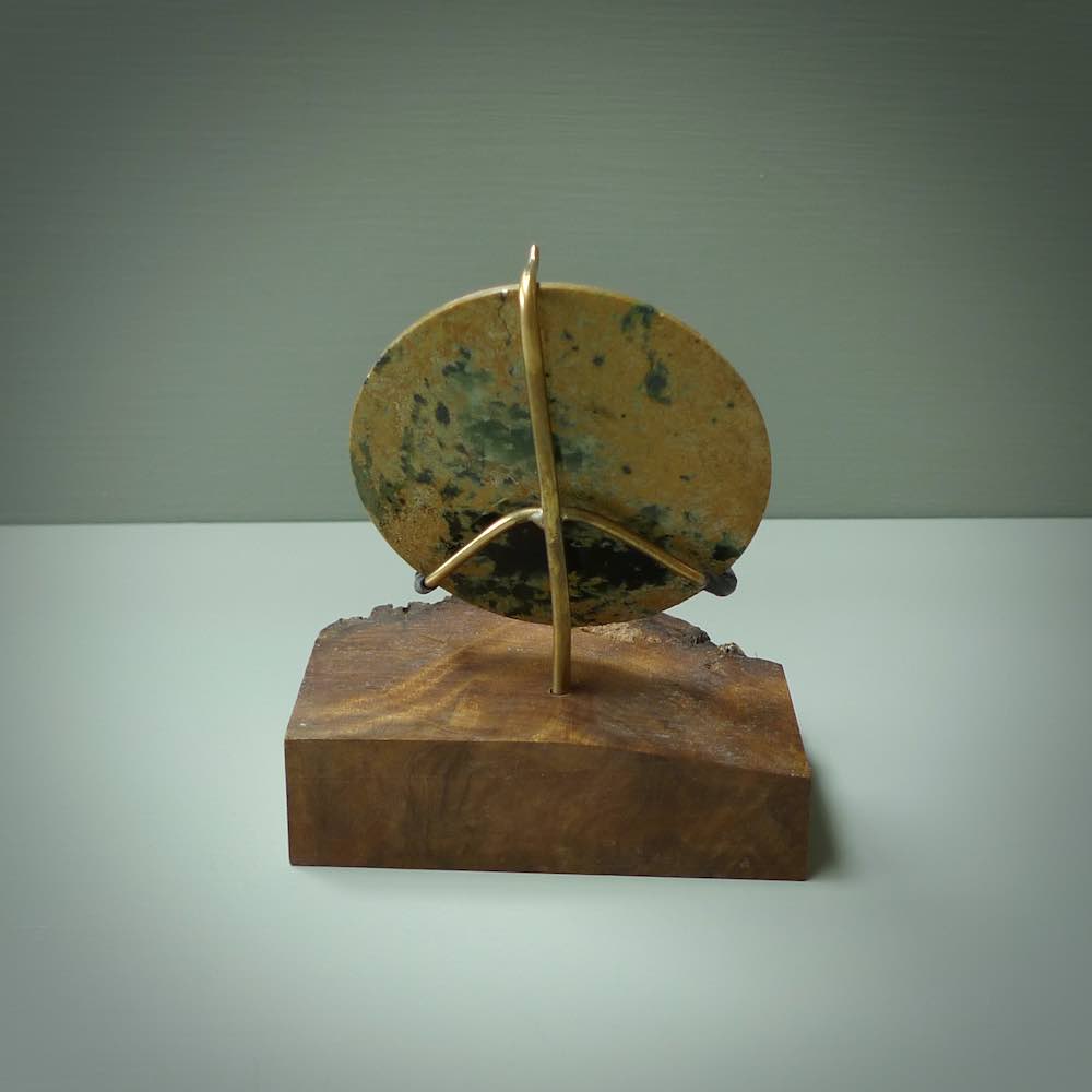 Hand carved New Zealand Flower Jade Disc with wooden stand sculpture. Hand carved here in New Zealand by Alex Sands Studio. This is a 'one only' sculpture, a beautiful display piece.