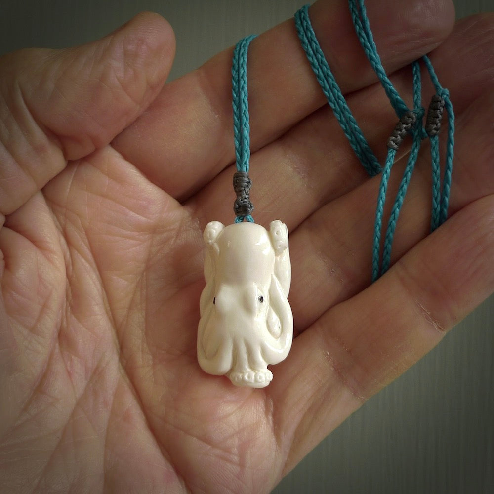 This is a beautiful little hand carved octopus pendant. It is a very cute little pendant that we have carved in natural, untreated bone. We provide these with Black adjustable cords and we shipping is included worldwide so there are no hidden costs when you reach checkout. Hand carved jewellery by NZ Pacific for sale online.