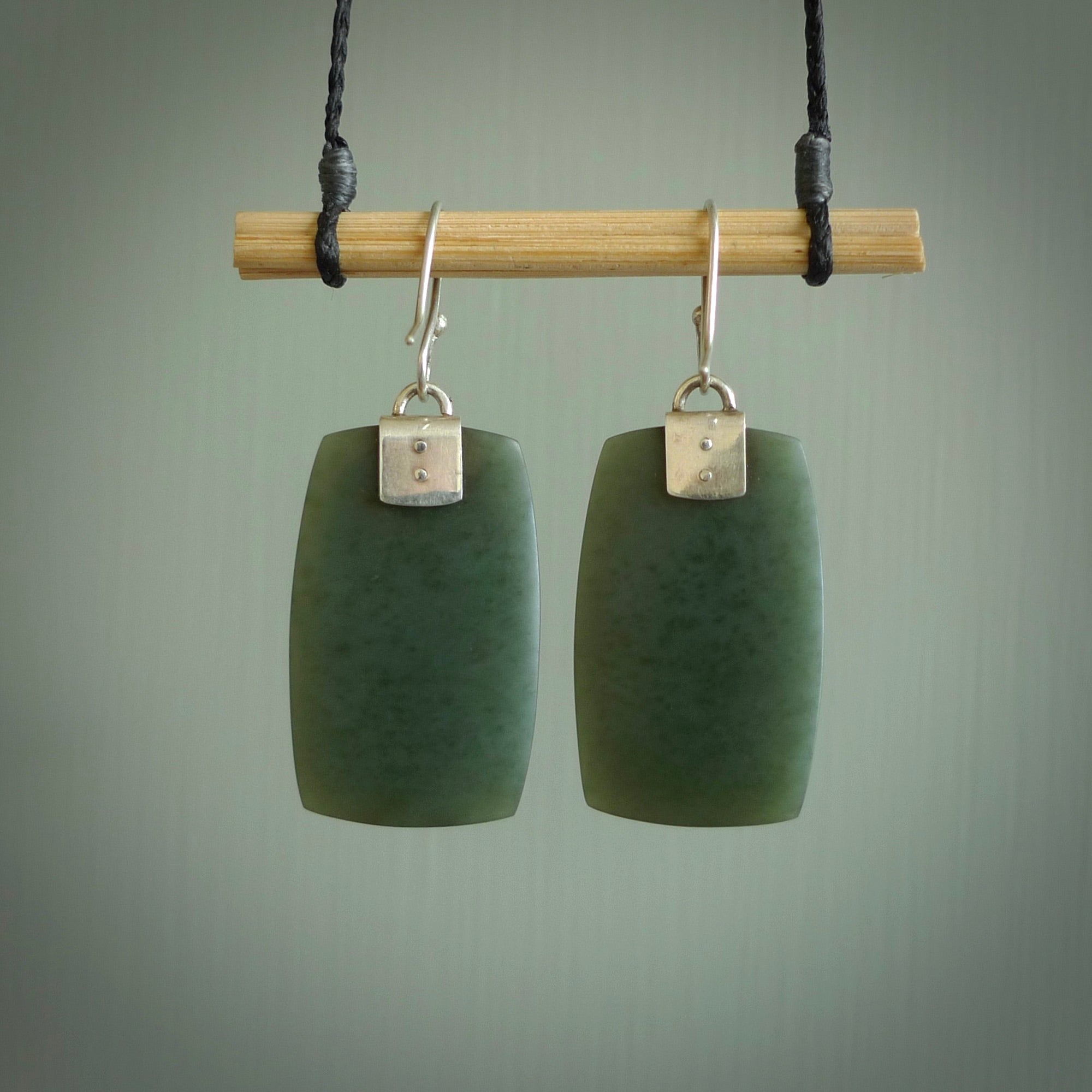 These are stunning large drop jade earrings carved in New Zealand by Josey Coyle. It is carved from a deep green piece of New Zealand Jade and with Sterling Silver hooks and findings.