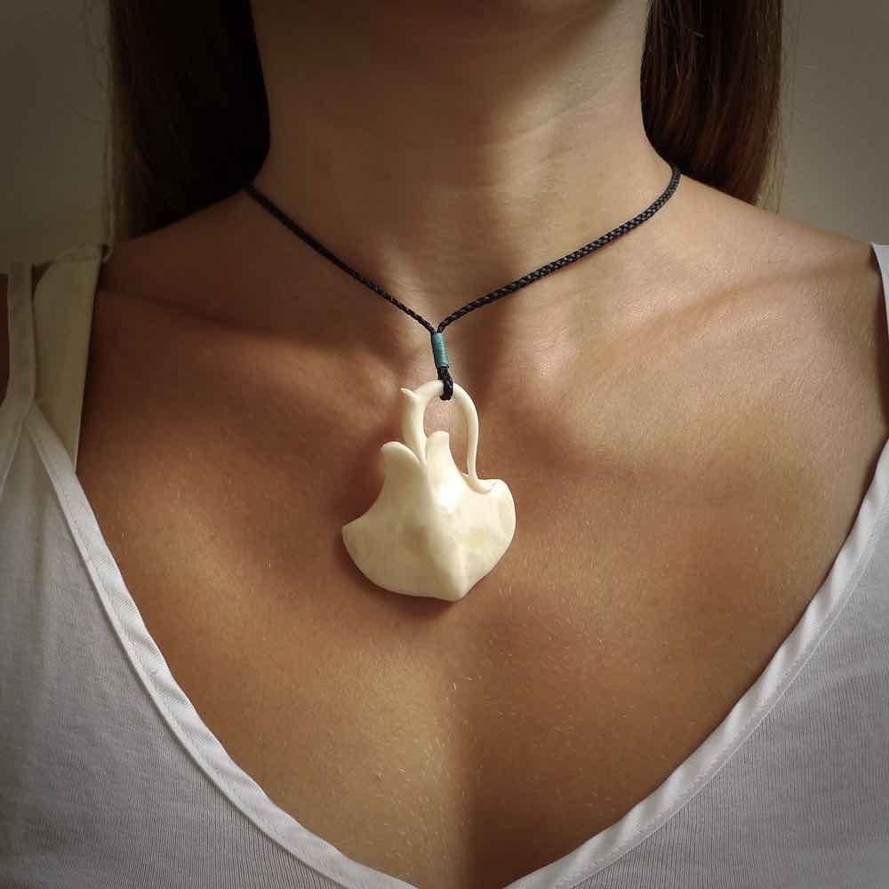 Hand carved stingray pendant. Natural bone pendants from NZ Pacific.