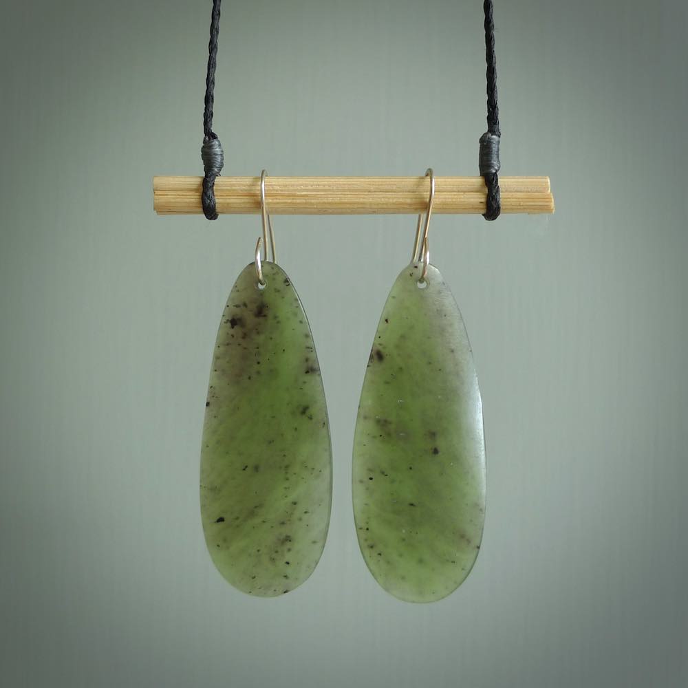 These are stunning large drop shaped jade earrings carved in New Zealand by Darren Hill. It is carved from a semi-translucent light green piece of New Zealand Jade and with Sterling Silver hooks.