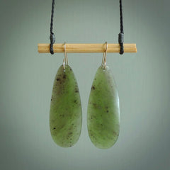 These are stunning large drop shaped jade earrings carved in New Zealand by Darren Hill. It is carved from a semi-translucent light green piece of New Zealand Jade and with Sterling Silver hooks.