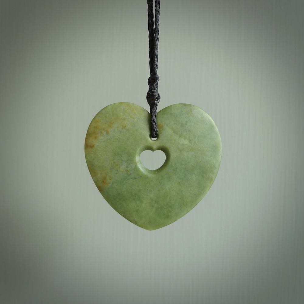 A large hand-carved Jade heart pendant. These are lovely pendants carved from exquisite New Zealand pounamu. Free worldwide delivery. Delivered to you on an adjustable cord.