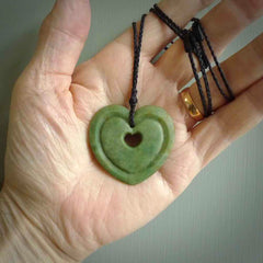 A large hand-carved Jade heart pendant. These are lovely pendants carved from exquisite New Zealand pounamu. Free worldwide delivery. Delivered to you on an adjustable cord.