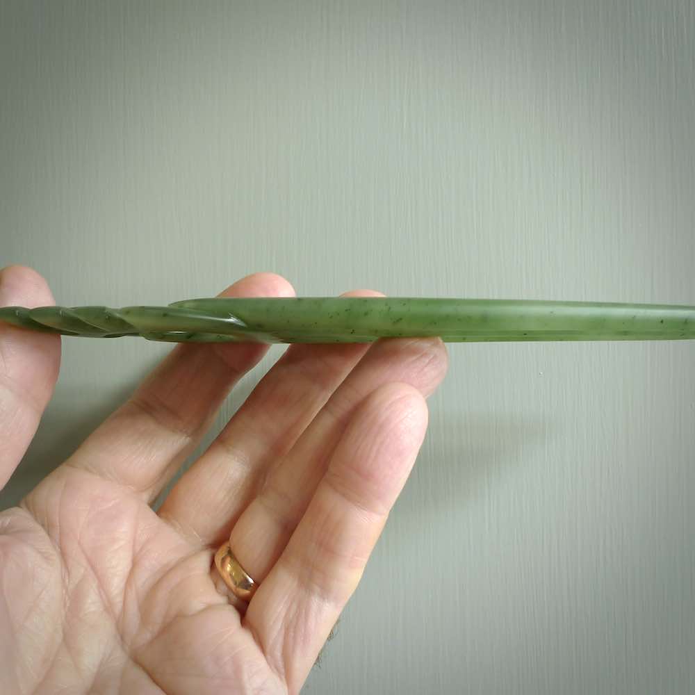 A hand carved New Zealand Jade Heru comb. A large hand made Heru combe  by New Zealand artist Kerry Thompson. Kerry has carved two Haast eagles at the top of the comb - this is an exquisite work of art and would be perfect for an enthusiasts collection.