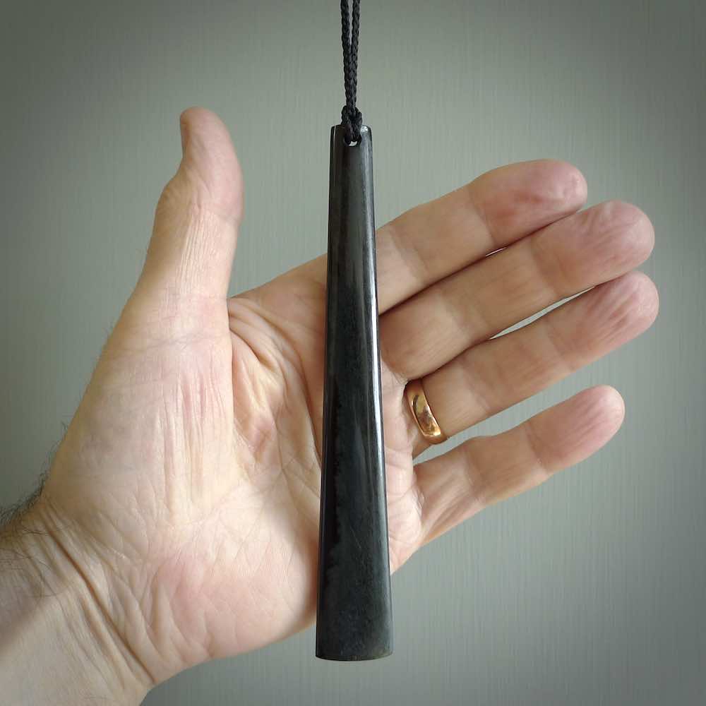 A hand carved large Black Jade drop, roimata, necklace. The cord is a black colour and is a fixed length. A large sized hand made drop necklace by New Zealand artist Kerry Thompson. One off work of art to wear.