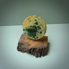 Hand carved New Zealand Flower Jade Disc with wooden stand sculpture. Hand carved here in New Zealand by Alex Sands Studio. This is a 'one only' sculpture, a beautiful display piece.