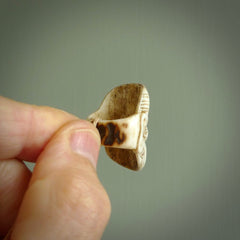 Hand carved Moko man face ring. Made from Red Deer antler in New Zealand. Unique Moko Man ring hand made from deer antler by master bone carver Fumio Noguchi. Spectacular collectable work of art, made to wear. One only ring, delivered to you at no extra cost with express courier.