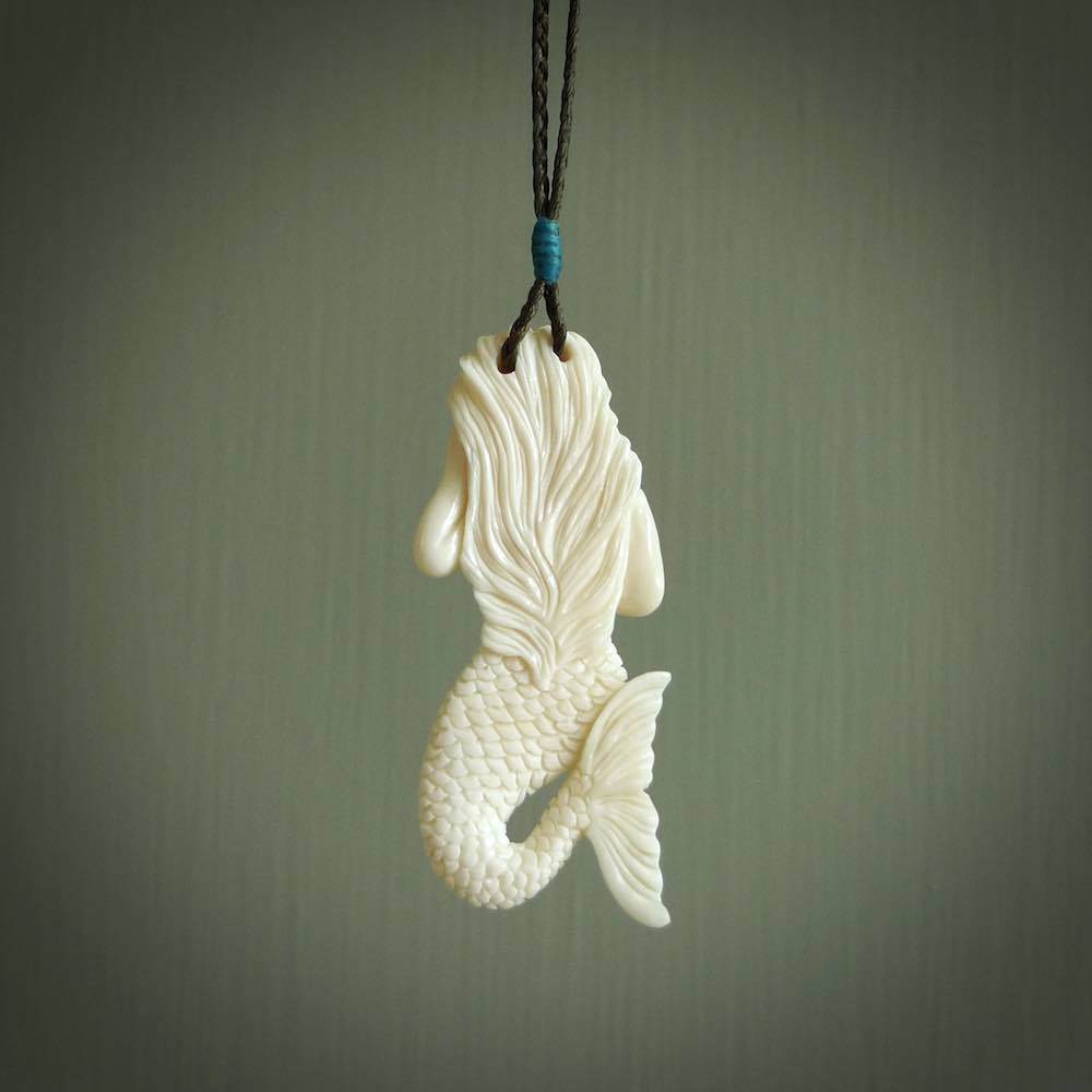 Hand carved natural bone mermaid pendant. Hand made from real bone. Art to wear.