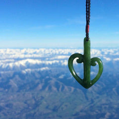 This is a beautiful koru pendant designed with a little inspiration from our national airline, Air New Zealand. It is carved from green jade which we source in Aceh and it is a lovely bright green with some dark speckled inclusions. A wonderful pendant.