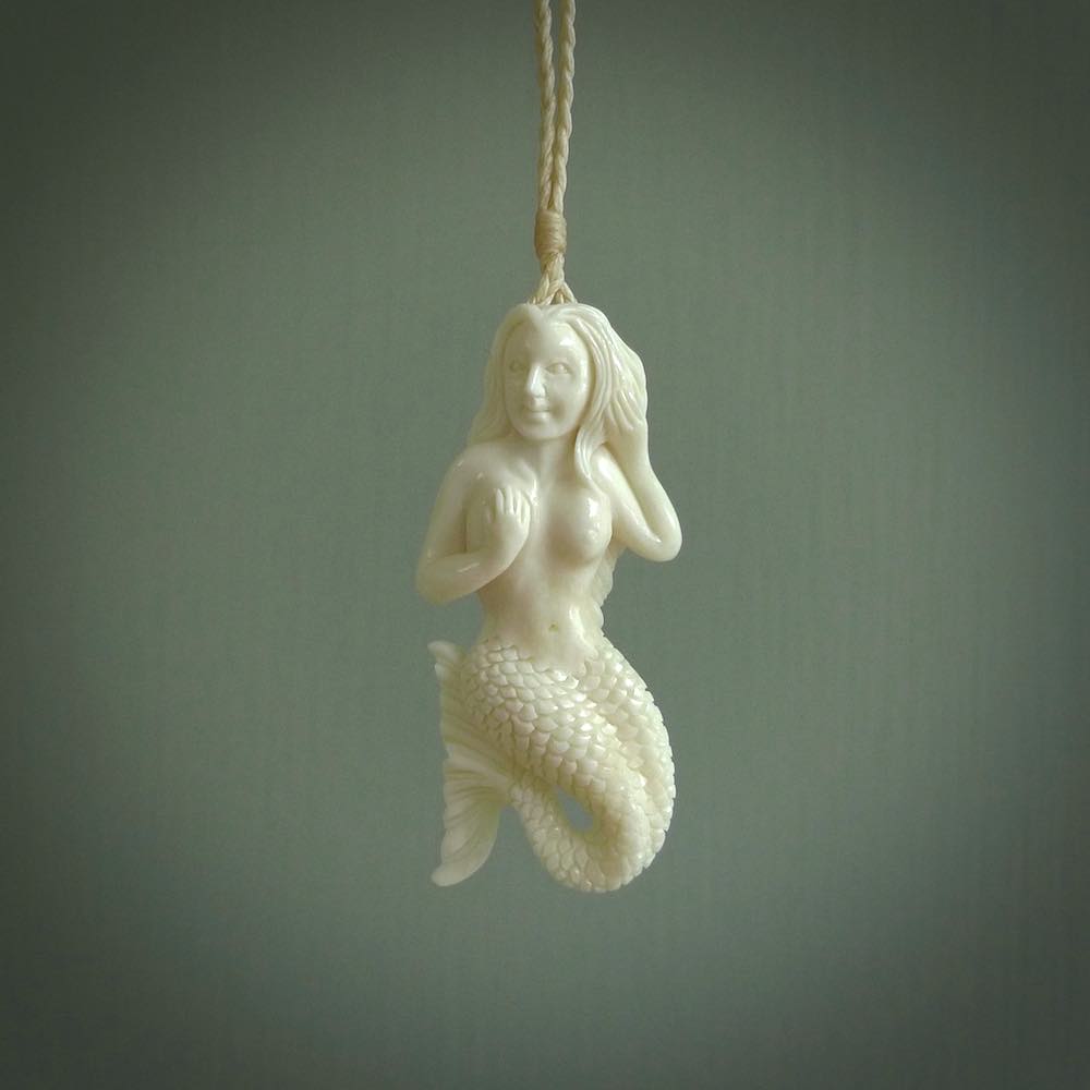 Hand carved natural bone mermaid pendant. Hand made from real bone. Art to wear.