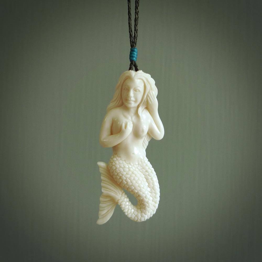 Hand carved natural bone mermaid pendant. Hand made from real bone. Art to wear.