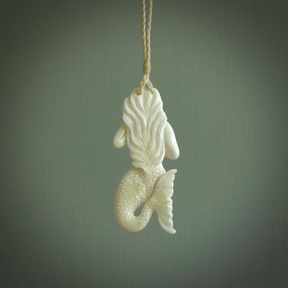 Hand carved natural bone mermaid pendant. Hand made from real bone. Art to wear.