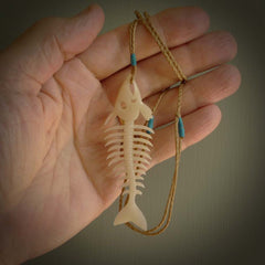 Hand carved bone fish skeleton pendant. Hand made bone fish necklace. Fish themed jewellery. Ocean themed pendant. One only necklace provided with adjustable cord and free delivery.