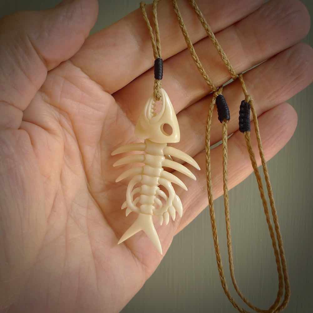 Hand carved bone fish skeleton pendant. Hand made bone fish necklace. Fish themed jewellery. Ocean themed pendant. One only necklace provided with adjustable cord and free delivery.