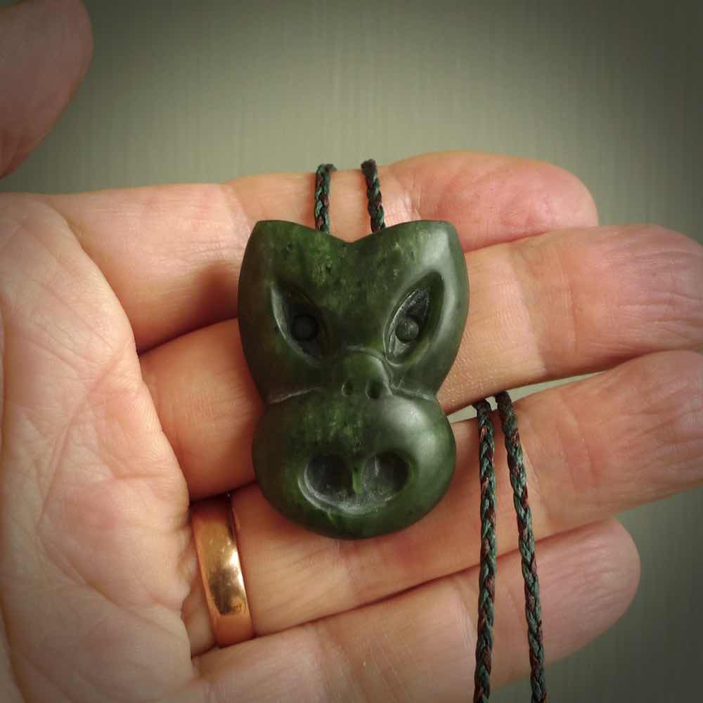 Hand carved New Zealand Jade Pounamu Wheku face pendant. Carved from New Zealand Jade by NZ Pacific. Hand crafted Jade jewellery for sale online. Pacific carving pendant, striking and unique delivered to you with Express Courier at no extra cost.